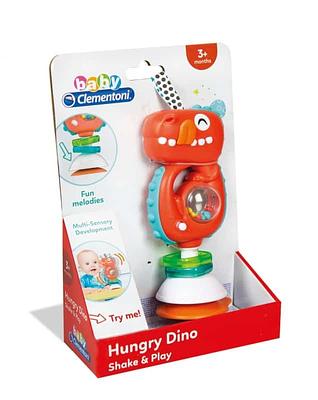 O Dino Comilão é um dinossauro brincalhão que faz sons e toca melodias quando é abanado. Com a sua prática ventosa ele mantém-se facilmente em pé em qualquer mesa ou cadeira de bebé.